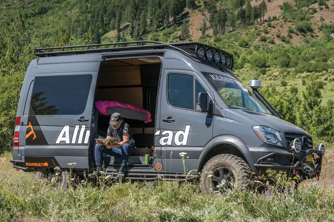 Owner sitting in his Iglhaut Allrad Sprinter van Owner sitting in his Iglhaut Allrad Sprinter van