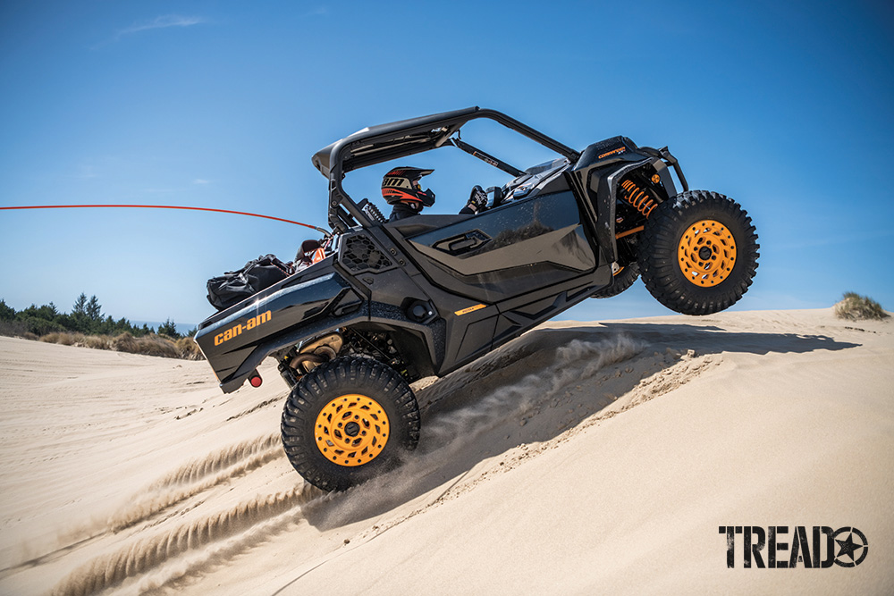 Can-Am Commander XT-P catches air on a sand dune.