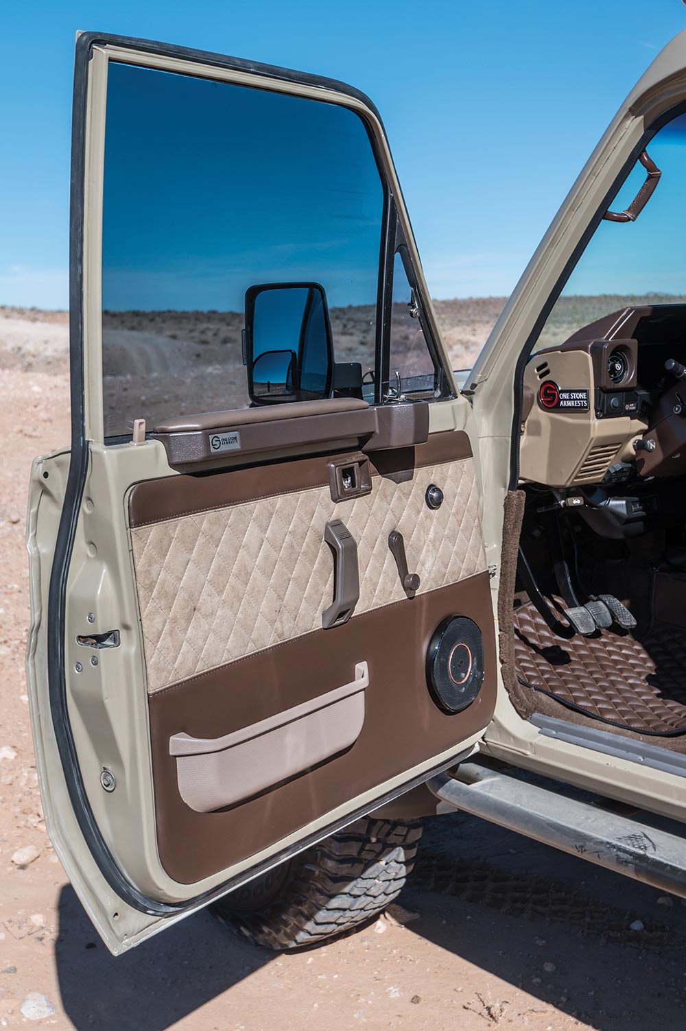 The door cards are luxurious with brown stitched leather.