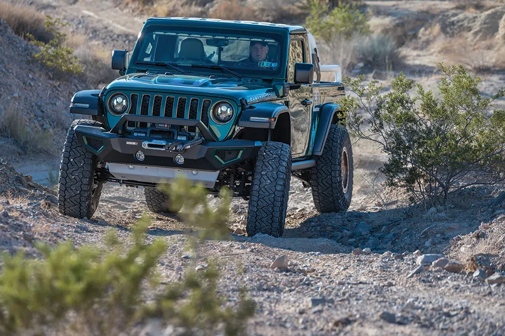 Rolling down a gravel trail, the JTe approaches from the front.