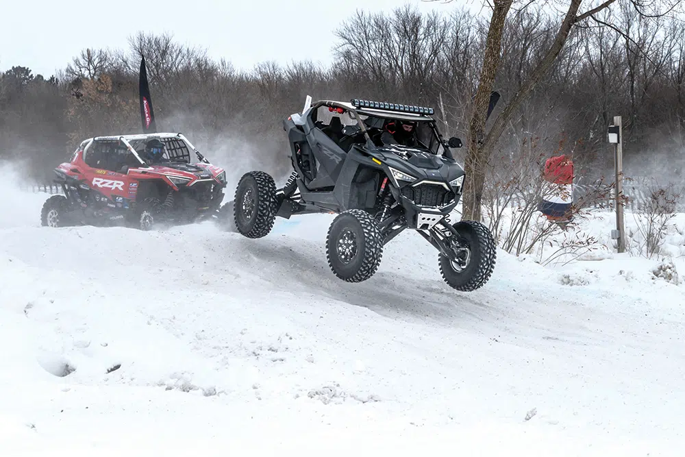 Big berm jump, tight turn, and jump back onto the frozen lake