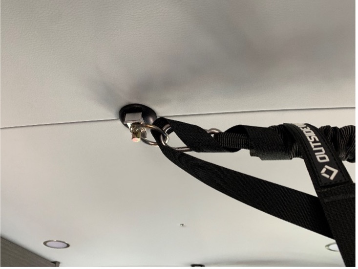 Custom fitment for strap on ceiling of van