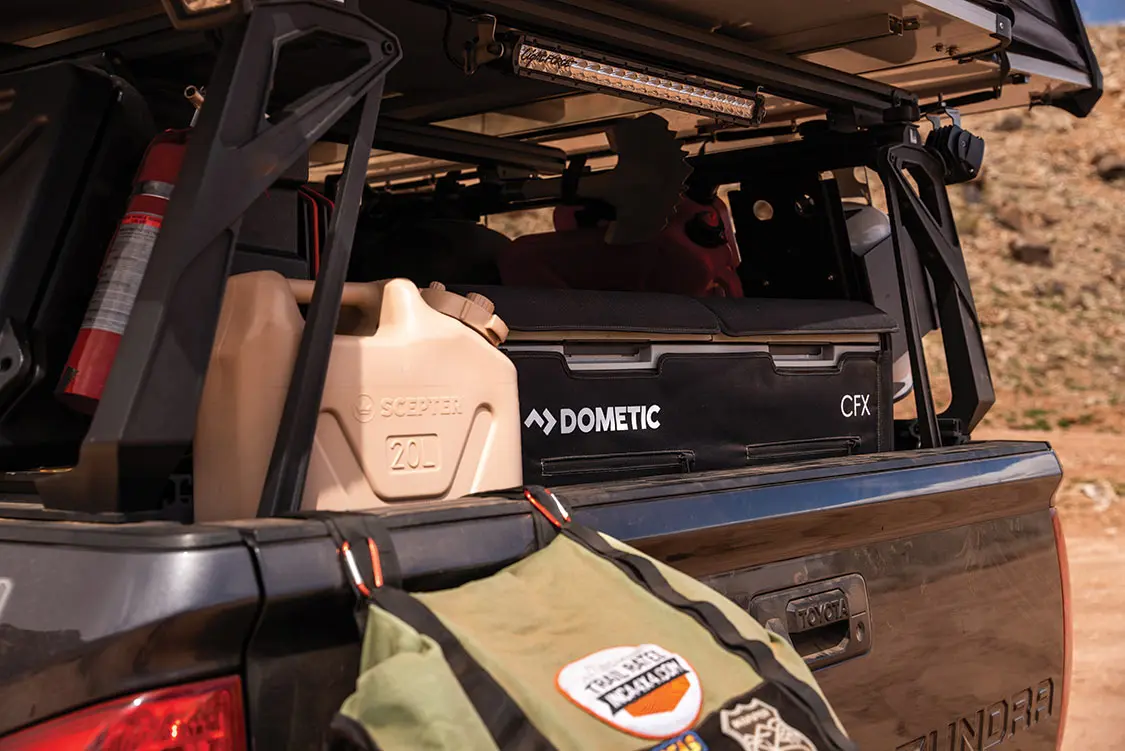 A Dometic fridge and 20L water jug