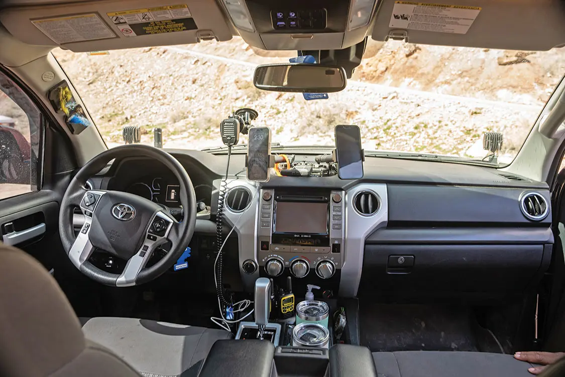 The dash is kept simple, with phone mounts and Midland Radios