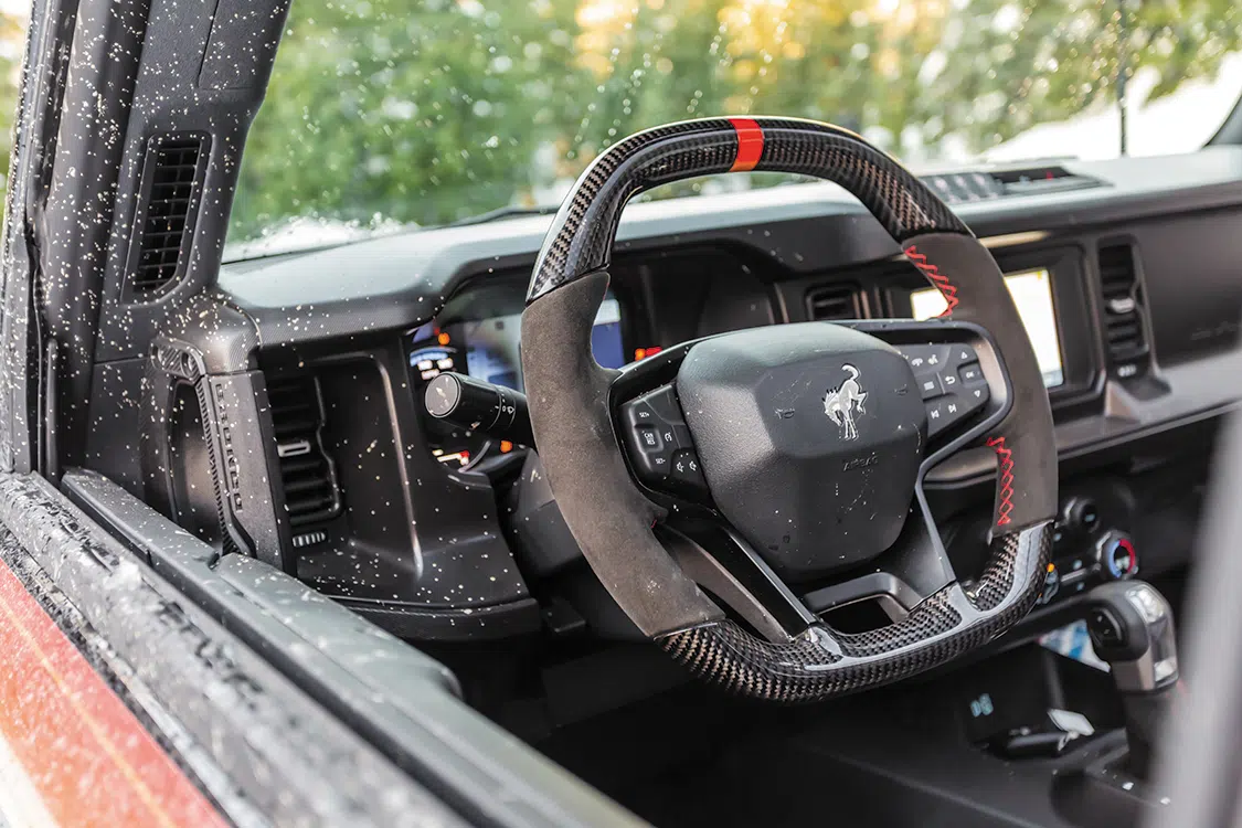 The reshaped carbon/suede OEM Bronco steering wheel