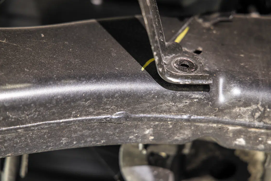 Remove the side supports on each side of the frame