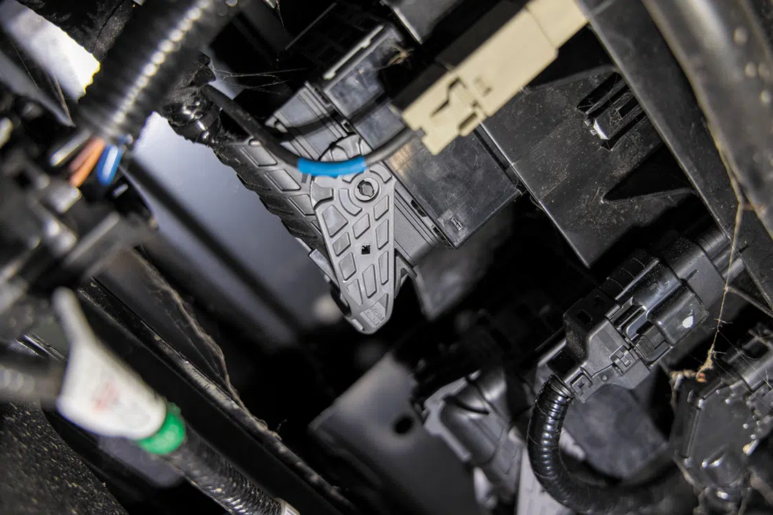 Unhook the bumper harness from the main wiring harness